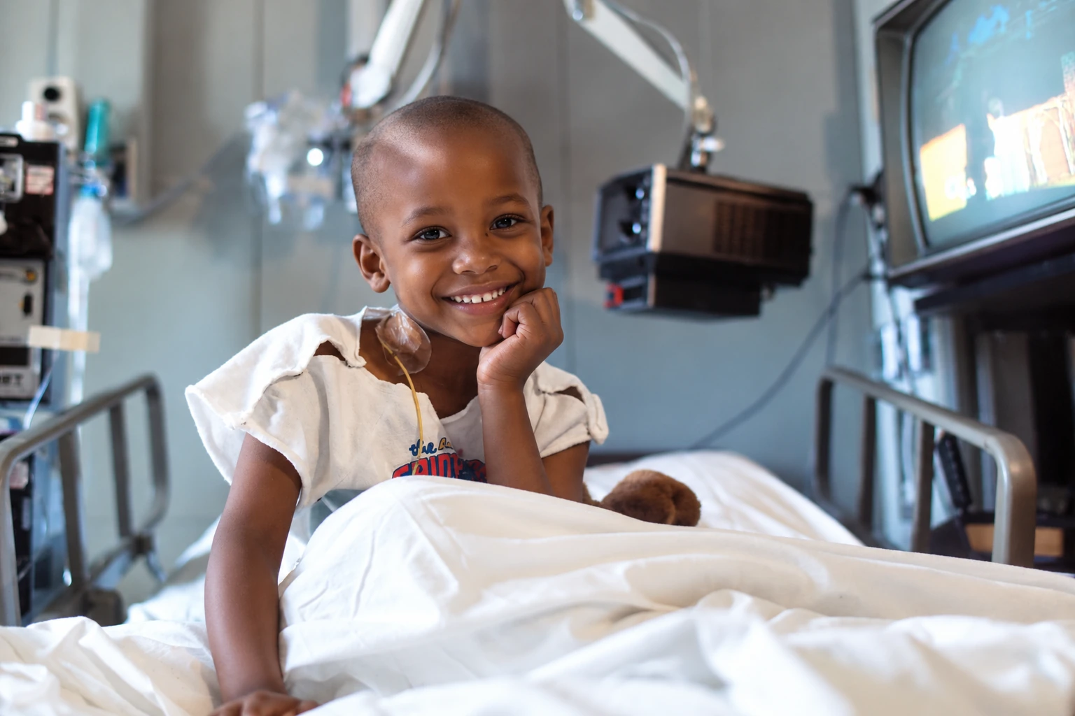 Smiling African child in a hospital bed