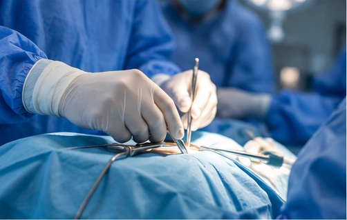Gloved surgical team at work